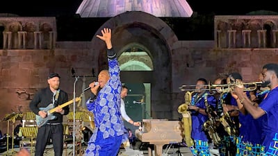 Nigerian musician Femi Kuti, second, left) performs with Coldplay at the Citadel.