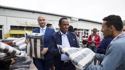Juma Al Dhaheri, UAE Ambassador to Serbia, and Nenad Ivanisevi, Serbian state secretary at the ministry of labour, employment, veteran and social affairs, deliver gifts for residents of the Home for Children and Youth in Sremica, near Belgrade, on Tuesday. Christopher Pike / The National