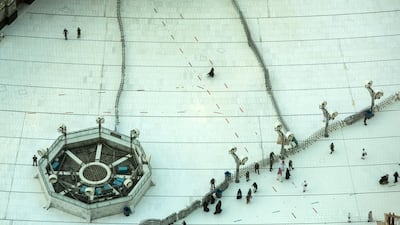 Barriers and a checkpoint set up to allow only permitted pilgrims as a precaution against coronavirus outside the Grand Mosque in Makkah. AP