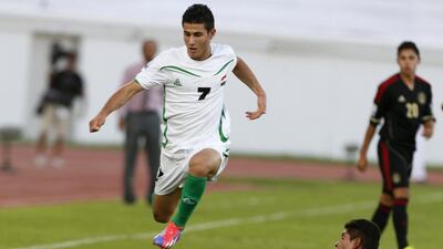 Iraq's Sherko Kareem jumps over Mexico's Salomon Wbias during their Under 17 World Cup match in Al Ain on Tuesday, which Mexico won 3-1. Karim Sahib / AFP PHOTO