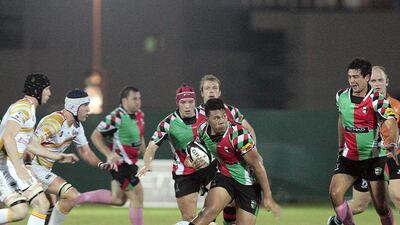 Mark Hibbs, in the red cap, and his Abu Dhabi Harlequins teammates fell 24-17 to Dubai Hurricanes in a UAE Premiership game on Friday night. Jeffrey E Biteng / The National