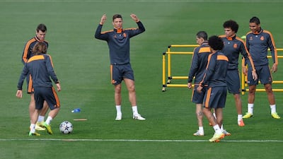 Cristiano Ronaldo, centre, of Real Madrid reacts beside teammates during the team training at Valdebebas training ground. Real Madrid will play Bayern Munich in a Uefa Champions League semi-final, first leg match in Madrid on Wednesday. Denis Doyle/Getty Images