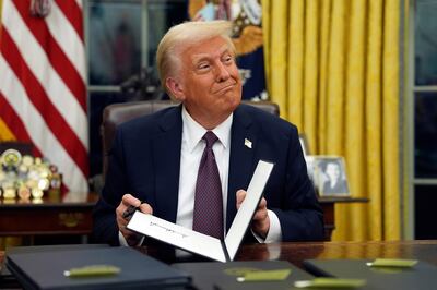 President Donald Trump signs executive orders in the Oval Office. AP