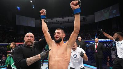 Khamzat Chimaev has his arm raised after his decision victory over Gilbert Burns in their welterweight fight at UFC 273 at VyStar Veterans Memorial Arena on April 09, 2022. Zuffa LLC