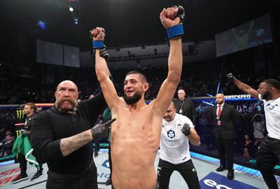 Khamzat Chimaev has his arm raised after his decision victory over Gilbert Burns in their welterweight fight at UFC 273 at VyStar Veterans Memorial Arena on April 09, 2022. Zuffa LLC
