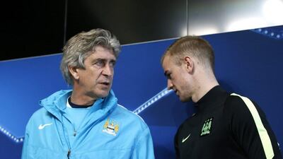 Manchester City manager Manuel Pellegrini and Joe Hart during a news conference. Reuters / Carl Recine