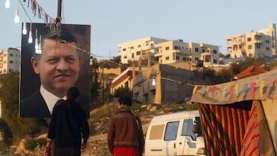 Posters and banners for today’s elections are displayed in the streets near Amman.