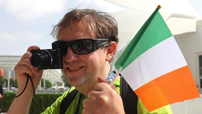 A visitor takes a picture of the celebrations.