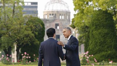 US president Barack Obama bids a farewell to Japanese prime minister Shinzo Abe after laying a wreath in front of a cenotaph to offer prayers for victims of the atomic bombing in 1945 at Hiroshima Peace Memorial Park with viewing the Atomic Bomb Dome in Hiroshima. Kimimasa Mayama /EPA