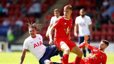 Tottenham attacker Dele Alli is challenged by Leyton Orient's Paul Smyth during the 1-1 draw.