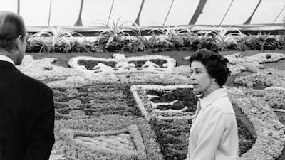 Queen Elizabeth II and Prince Philip viewing the carpet bedding of the Royal Coat of Arms in 1975