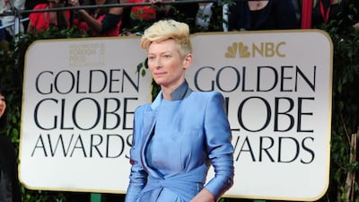 Nominee for Best Performance by an Actress in a Motion Picture Drama, Tilda Swinton poses on the red carpet. AFP PHOTO / Frederic J. BROWN