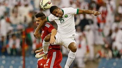 Nasser Al Shamrani of Saudi Arabia and Majed Hassan of UAE in an aerial duel for the ball. Courtesy Al Ittihad