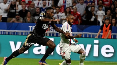 Ajaccio's French defender Oumar Gonzalez and Lyon's French forward Alexandre Lacazette fight for the ball. AFP