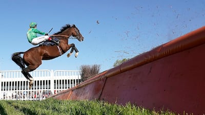 Richard Johnson on Invincible Don leaps at the open ditch in The Best Odds Guaranteed At MansionBet Novices' Handicap Chase before being pulled up after the fence at Huntingdon Racecourse in the UK. Getty Images