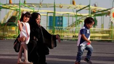 Emirati mother Sarah Al Falasi with her three-year-old son, Mohammed, who has Down syndrome, and four-year-old daughter, Aljouhara, in Dubai. Silvia Razgova / The National