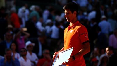 Novak Djokovic of Serbia leaves the stage after collecting the runners up trophy after defeat in the Men’s Singles Final against Stanislas Wawrinka of Switzerland on day fifteen of the 2015 French Open at Roland Garros on June 7, 2015 in Paris, France. (Photo by Dan Istitene/Getty Images)