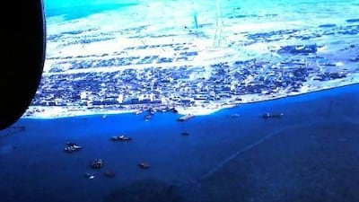 Abu Dhabi beach, 1968, showing the highway that ended abruptly in the desert, top centre, and Qasr Al Hosn, middle right. Courtesy of Neville Ryton