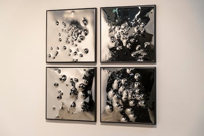 Anthony James's DIFC exhibition features a collection of circular and geometric sculptures, made of mirrors carefully placed within steel frames. Antonie Robertson / The National