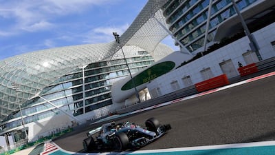 Mercedes' driver Lewis Hamilton steers his car during a practice session at the Yas Marina circuit. AFP