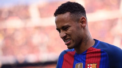 Barcelona’s Neymar reacts after a collision with Real Madrid’s Dani Carvajal (unseen). Josep Lago / AFP