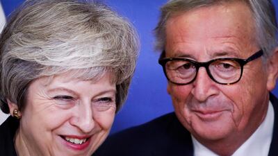 Theresa May (L) is welcomed by Jean-Claude Juncker prior to a EU summit in Brussels. EPA