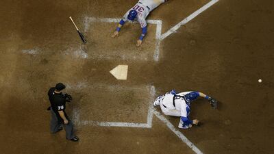 New York Mets' Michael Conforto scores past Milwaukee Brewers catcher Manny Pina during the ninth inning of a baseball game in Milwaukee. Morry Gash / AP Photo