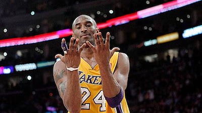 Los Angeles Lakers guard Kobe Bryant looks at his hands after fumbling with the ball. Jae C Hong / AP Photo