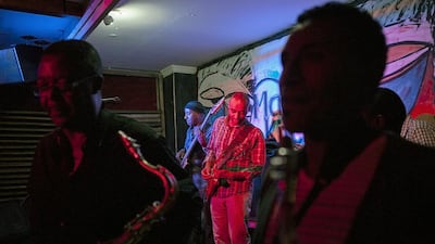Girum Mezmur, centre, guitarist and part owner of Jazzamba Club, performs at Mama’s Kitchen in Addis Ababa in February. The restaurant aims to become a hub for the city’s music scene. Zacharias Abubeker / AFP