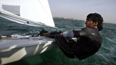 Adel Khaled puts his back into some practice for the single-handed lightweight Laser competition which gets under way today in China's Yelow Sea.