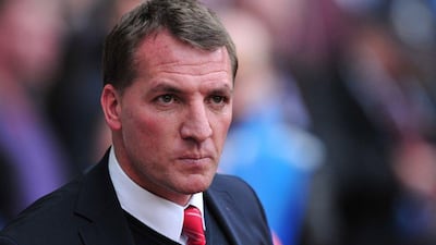 Liverpool and Brendan Rodgers are top of the Premier League table. Carl Court / AFP