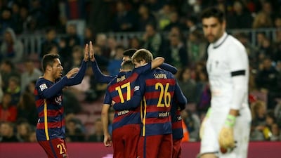 Barcelona players celebrate during their 6-1 Copa del Rey win at the Camp Nou on Wednesday night. Albert Gea / Reuters