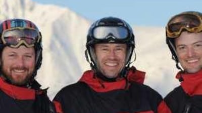 Adrian Hayes flanked by his teammates Devon McMiarmid, left, and Derek Crowe. The team hopes to reach its destination by Saturday or Sunday.