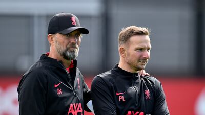 Liverpool Jurgen Klopp, left,with his assistant Pepijn Lijnders during training.
