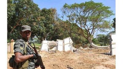 A Sri Lankan soldier stands guard at the cemetery of war heroes of Tamil Tigers at Kilinochchi, considered to be the rebels' political capital.