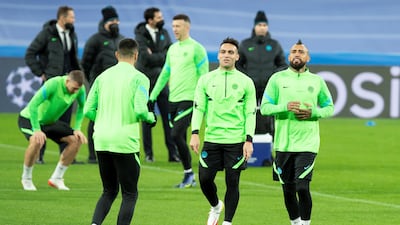 Lautaro Martinez and Arturo Vidal attend a training session at Santiago Bernabeu. EPA