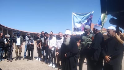 Sheikh Hikmat Al Hajiri, Syria's most senior Druze cleric, centre, speaks at Mr Al Jaramani's funeral