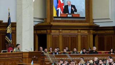 UK Prime Minister Boris Johnson addresses Ukrainian President Volodymyr Zelenskyy, left, and the country's MPs by video link. Reuters