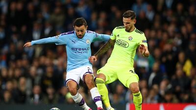 Bernardo Silva, left, played for Manchester City against Dinamo Zagreb in the Champions League - the evening before the FA charge was brought against him. Getty Images