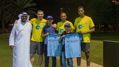 Abu Dhabi Tourism & Culture Authority teamed up with Manchester City to put two Make-A-Wish Foundation youngsters together with their sporting heroes. Hamad Alhousani, second left, and Bashar Alkaisi, second right, made a memory with, from left, Hani Al Zubaidi of Make-A-Wish and footballers Aleksandar Kolarov, Fernandinho and Tosin Adarabioyo. Courtesy Abu Dhabi Tourism