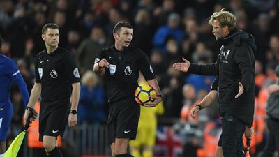 Liverpool manager Jurgen Klopp confronts referee Michael Oliver after the Premier League match against Chelsea at Anfield. Shaun Botterill / Getty Images