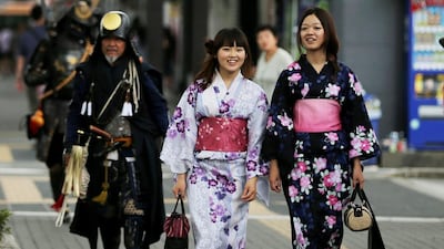 Japanese women dressed in Yuakata, summer kimono walk during the annual Himeji Yukata Festival on June 22, 2014 in Himeji, Japan. Yukata is a casual summer version of kimono, traditionally made of cotton instead of silk. The Himeji Yukata Festival was started by Himeji lord Sakakibara Masamune over 250 years ago. Buddhika Weerasinghe / Getty Images