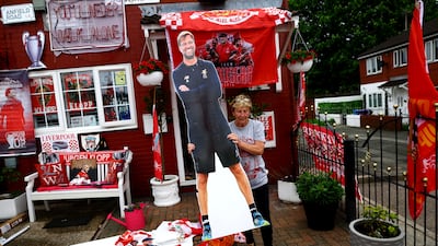 A local resident decorates her house in Liverpool before Jurgen Klopp's final match as manager. Reuters