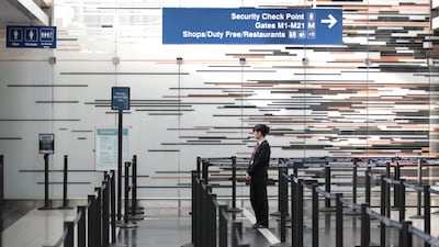 A worker staffs a security checkpoint in the international terminal at O'Hare Airport in Chicago, Illinois. AFP