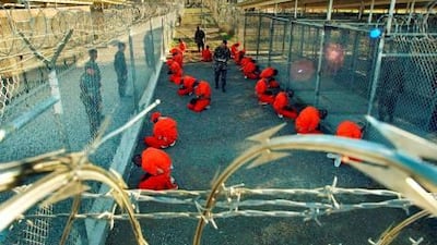Al Qaeda and Taliban detainees captured by US forces in Afghanistan kneel in a holding area at Camp X-Ray at the US naval base in Guantanamo Bay, Cuba. It is here, too, that Sikander, the hero of Salahuddin Khan's epic novel, is taken and tortured.