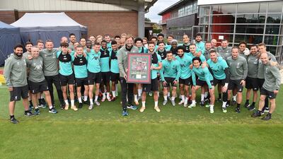 Jurgen Klopp manager of Liverpool presents departing Adam Lallana of Liverpool with a special picture. Getty