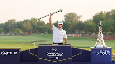 Nicolai Hojgaard of Denmark lifts the DP World Tour Championship trophy after his victory. Getty Images