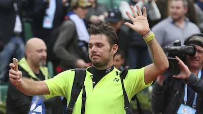 Switzerland’s Stan Wawrinka films himself after winning the quarter-final match against Spain’s Albert Ramos-Vinolas. David Vincent / AP Photo