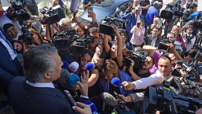 Tunisian presidential candidate Nabil Karoui speaks to journalists in front of his party's office in the capital Tunis. AFP