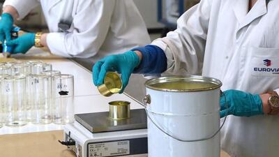 Researchers works on the manufacturing of new kinds of tar for smart roads at the Eurovia research centre in Merignac. Medhi Fedouach/AFP